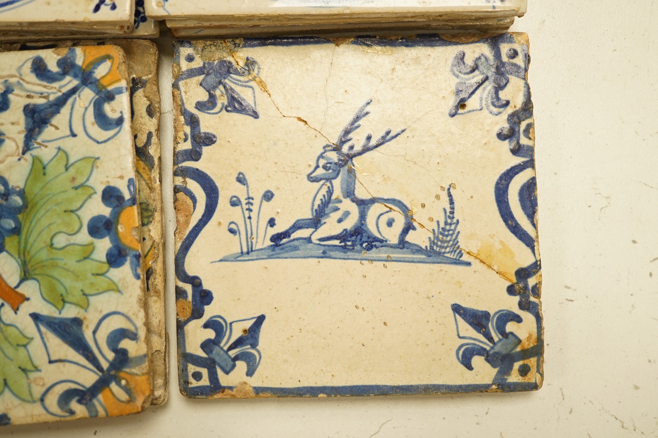 Four 18th century Delft tiles and nine 19th-century Delft blue and white animal tiles(13)